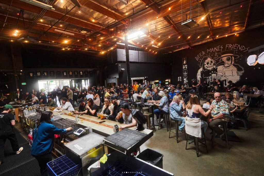 Interior of Black Plague Brewing with customers playing trivia